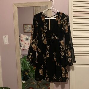 Beautiful Astr the label floral dress. Deep v in front, keyhole in the back.